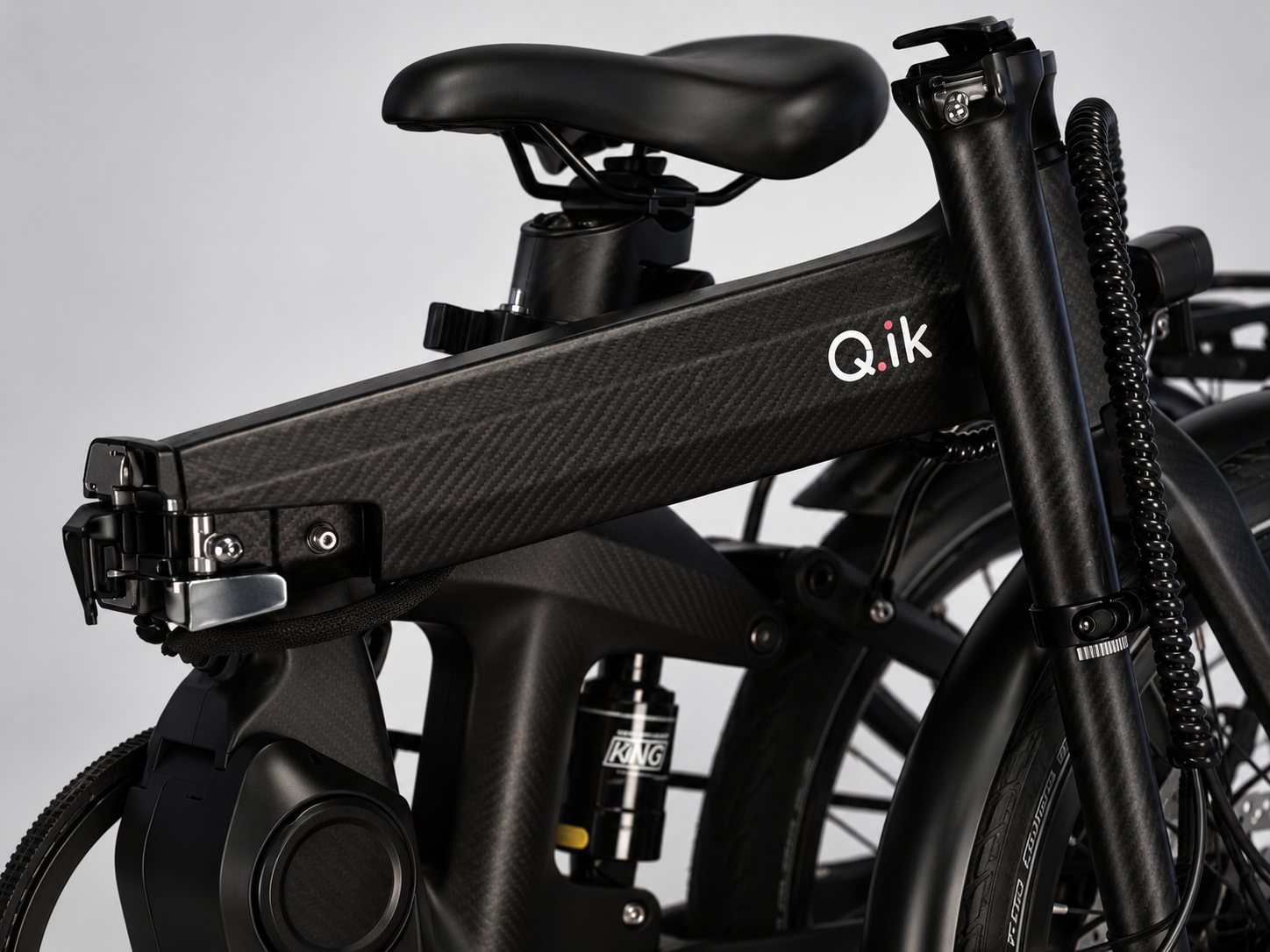 Carbon-fibre detail on a Q.ik folding e-bike frame