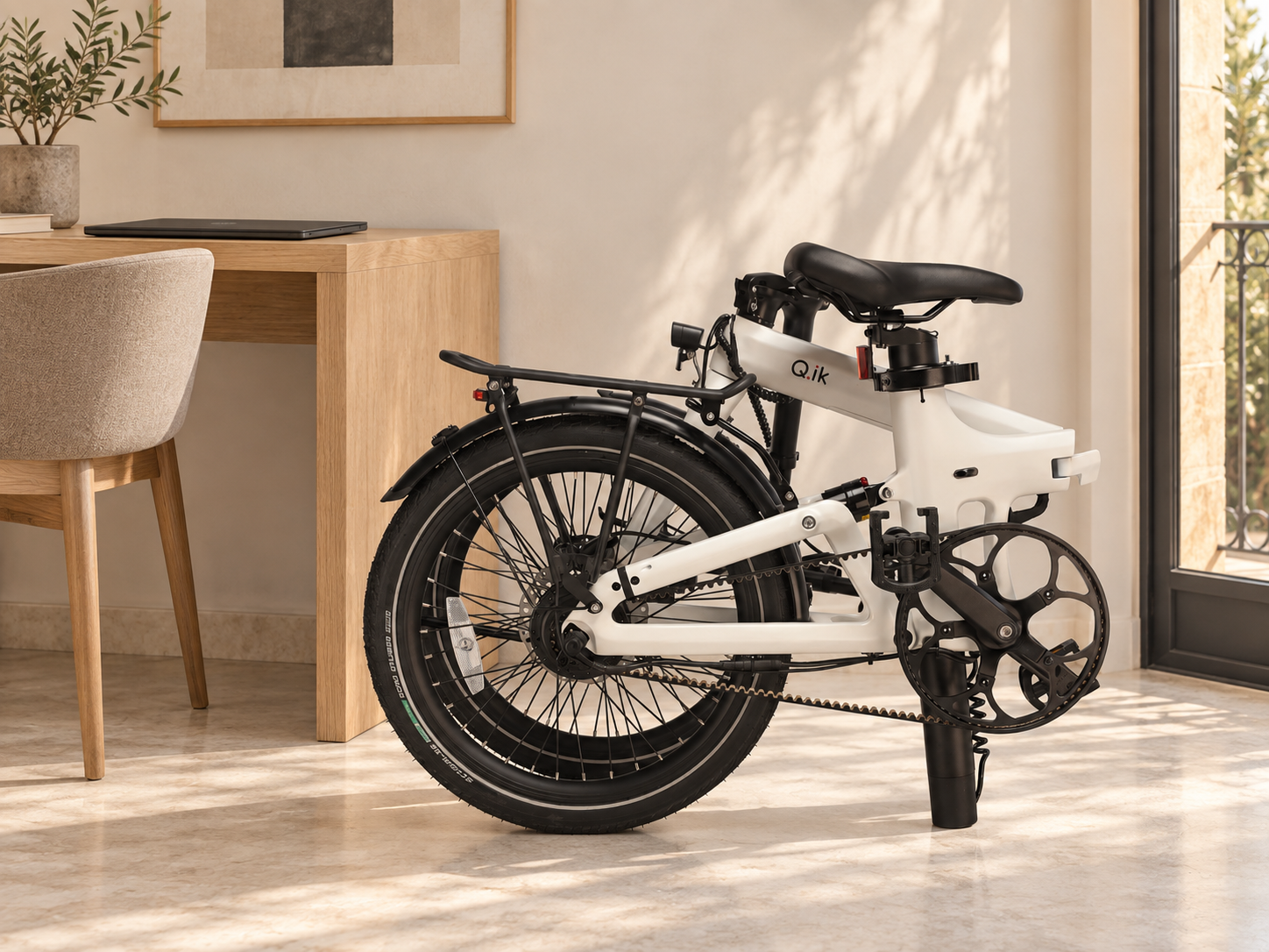 Folded Q.ik electric bike stored in a compact urban living space