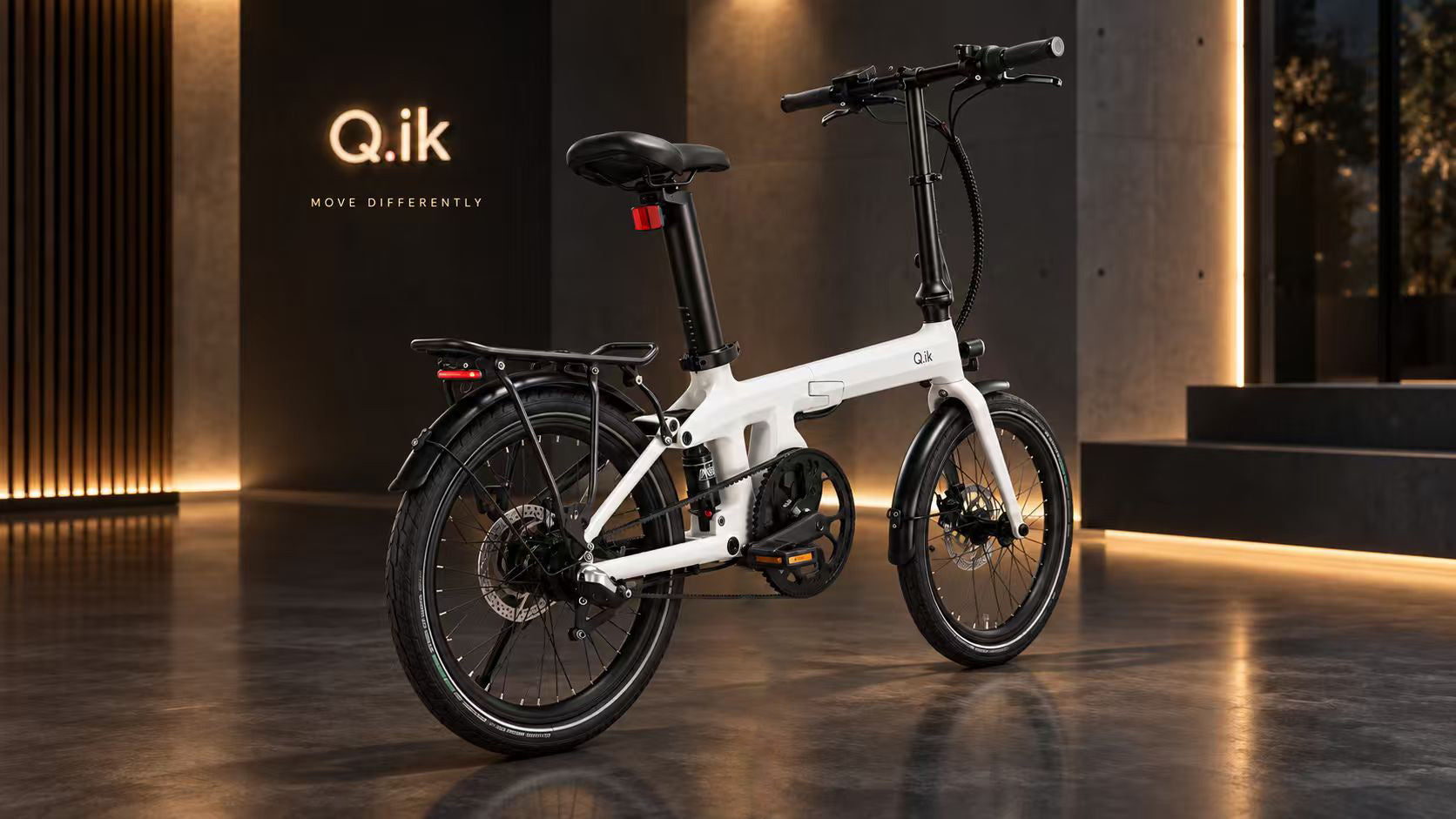 Q.ik Genava folding electric bike in a studio setting